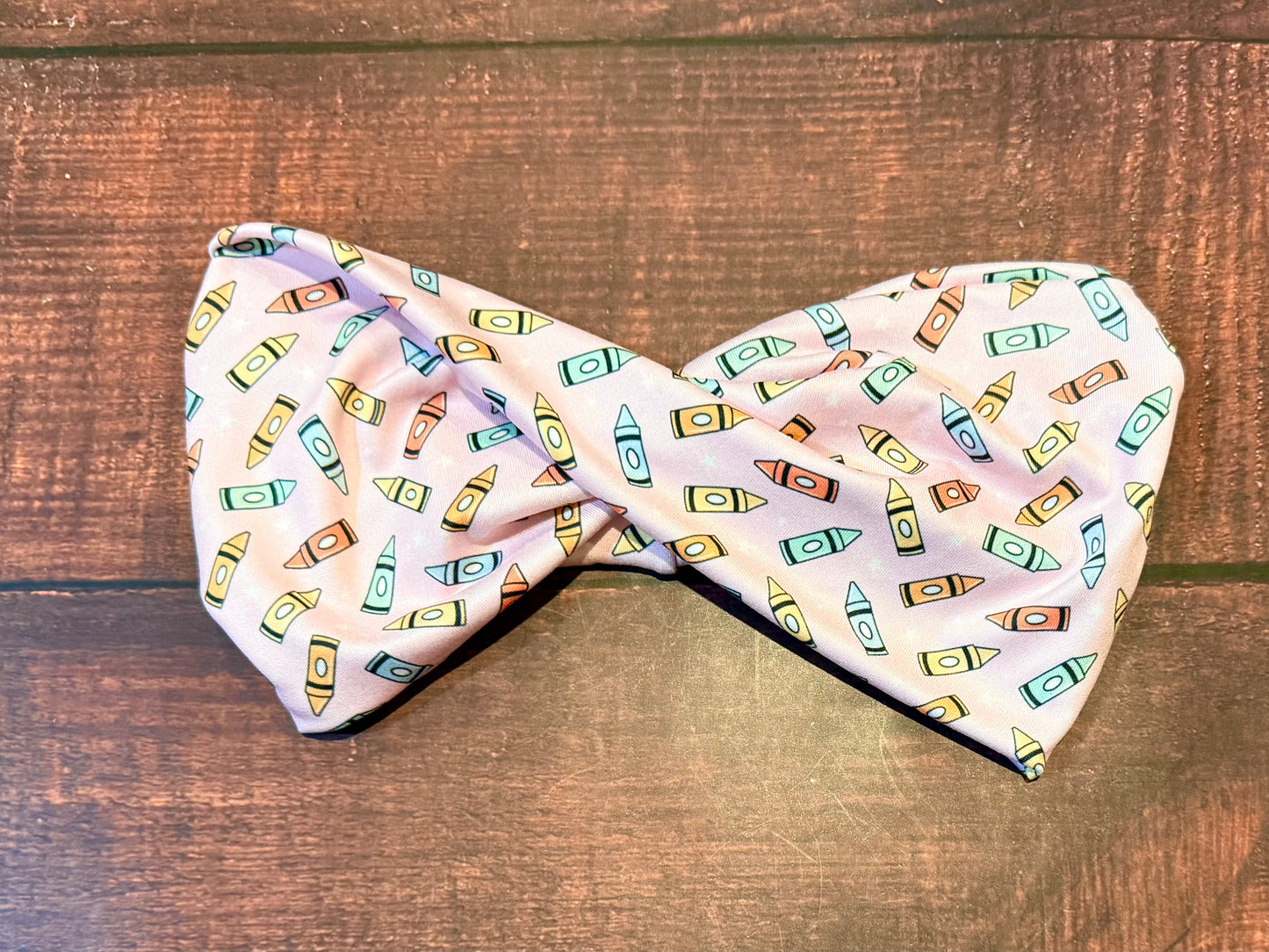 Crayons on pink-wide